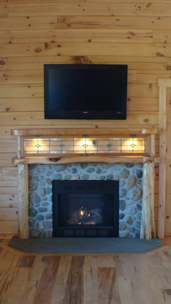 Soild Cherry Mantel with Cedar Columns and Antique Window with Mounted TV